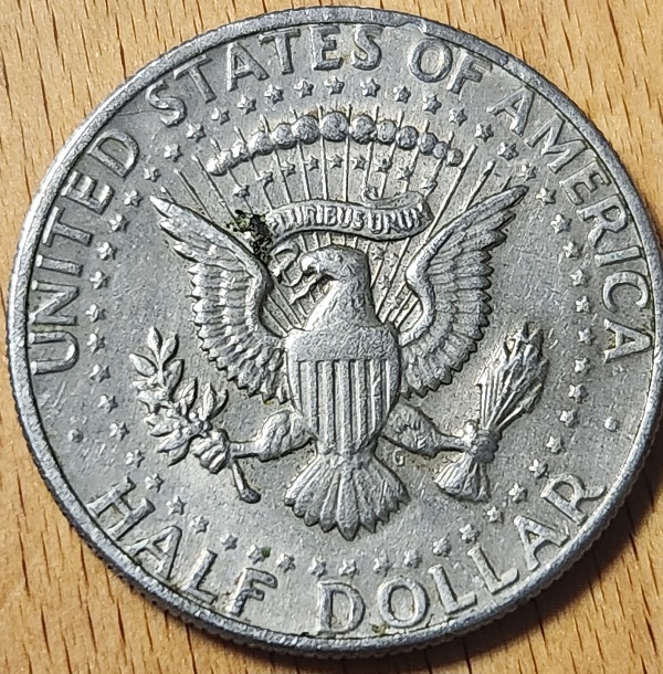 1973-Half-Dollar-PMD-Or-Ejection-Damage?