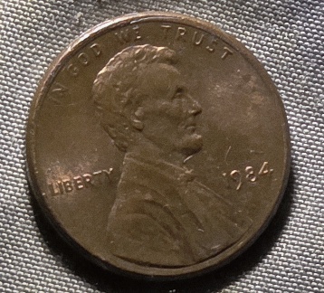 1984-Penny-Marking-Behind-Letters-On-Reverse-