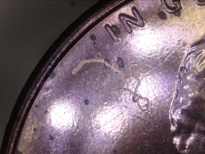 2020--LC-Struct-Thru-On-Obverse-With-2-Pieces-Of-Thread-Or-String