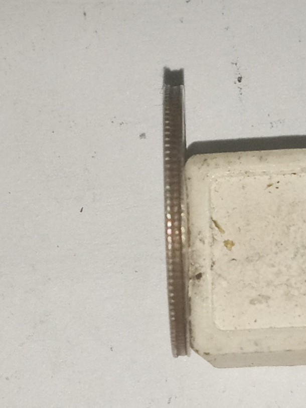 1967-Dime-That-Weighs-2.00-Grams-And-Looking-At-Reeded-Edge-You-Can-See-The-Layers-