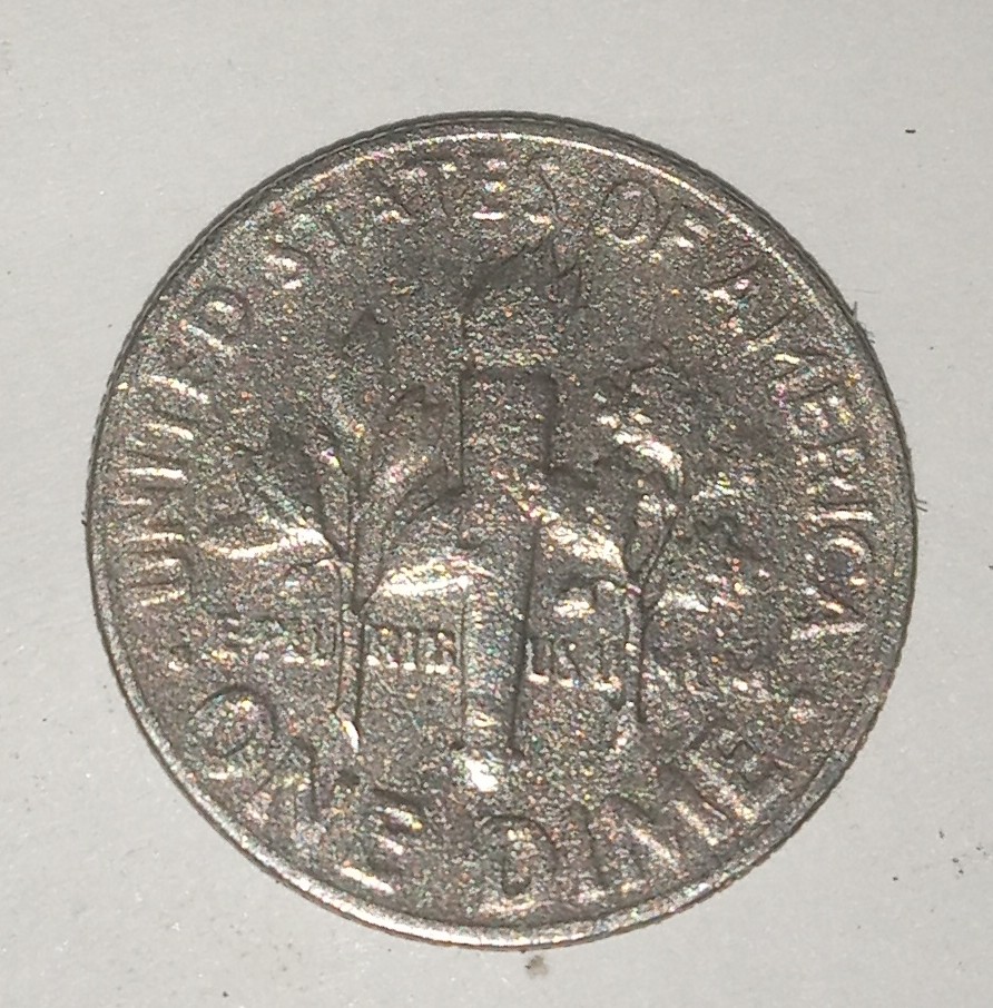 1967-Dime-That-Weighs-2.00-Grams-And-Looking-At-Reeded-Edge-You-Can-See-The-Layers-