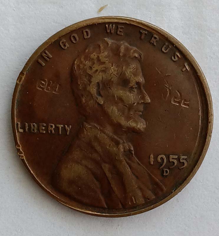 1955-D-Lincoln-Wheat-Cent-Strike-Through-Mint-And-Date-Stamps?
