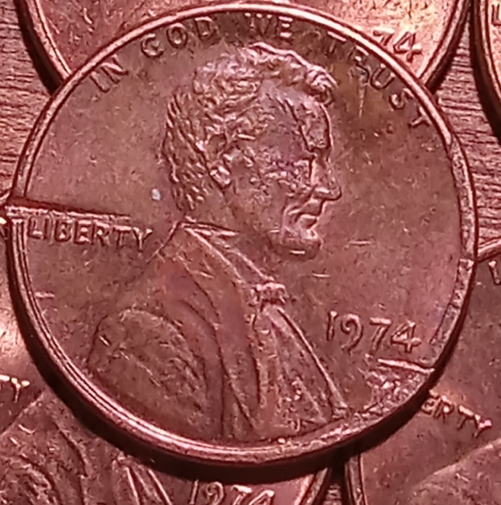 1974-P-1-Cent.-Is-This-Coin-Damaged-By-A-Feeder-Finger,-Or-Post-Mint?-Is-It-A-Denver-Minted-Coin?