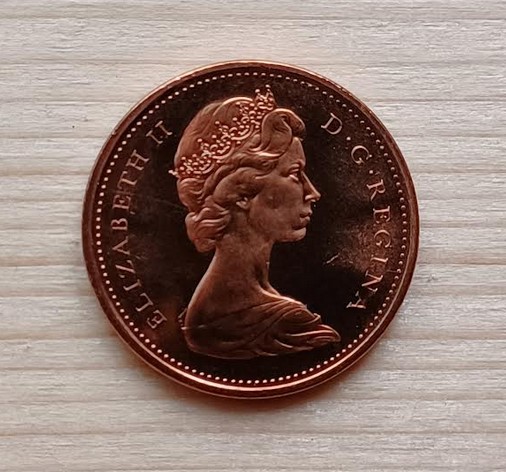 1967-Specimen-Penny-With-A-Struck-Thru-Or-Lamination-Error?