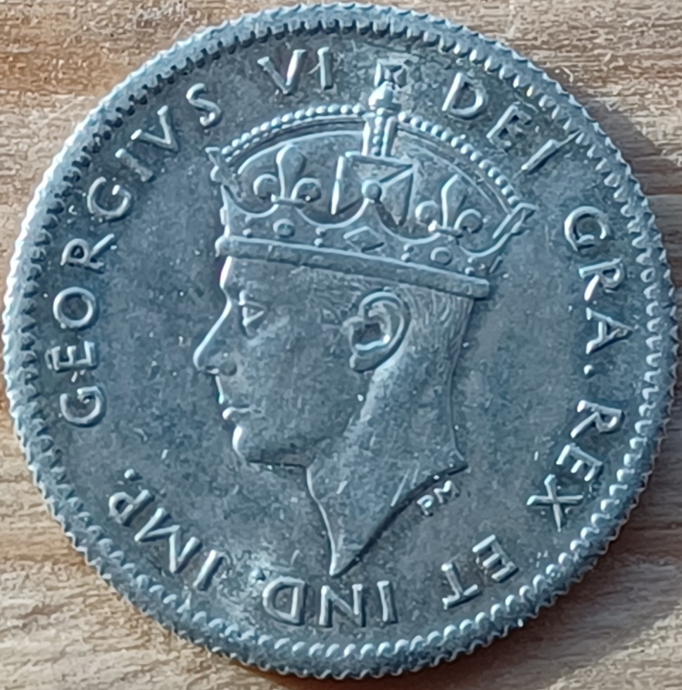 Is-This-1941-Newfi-5-Cent-Have-A-Repunched-4?