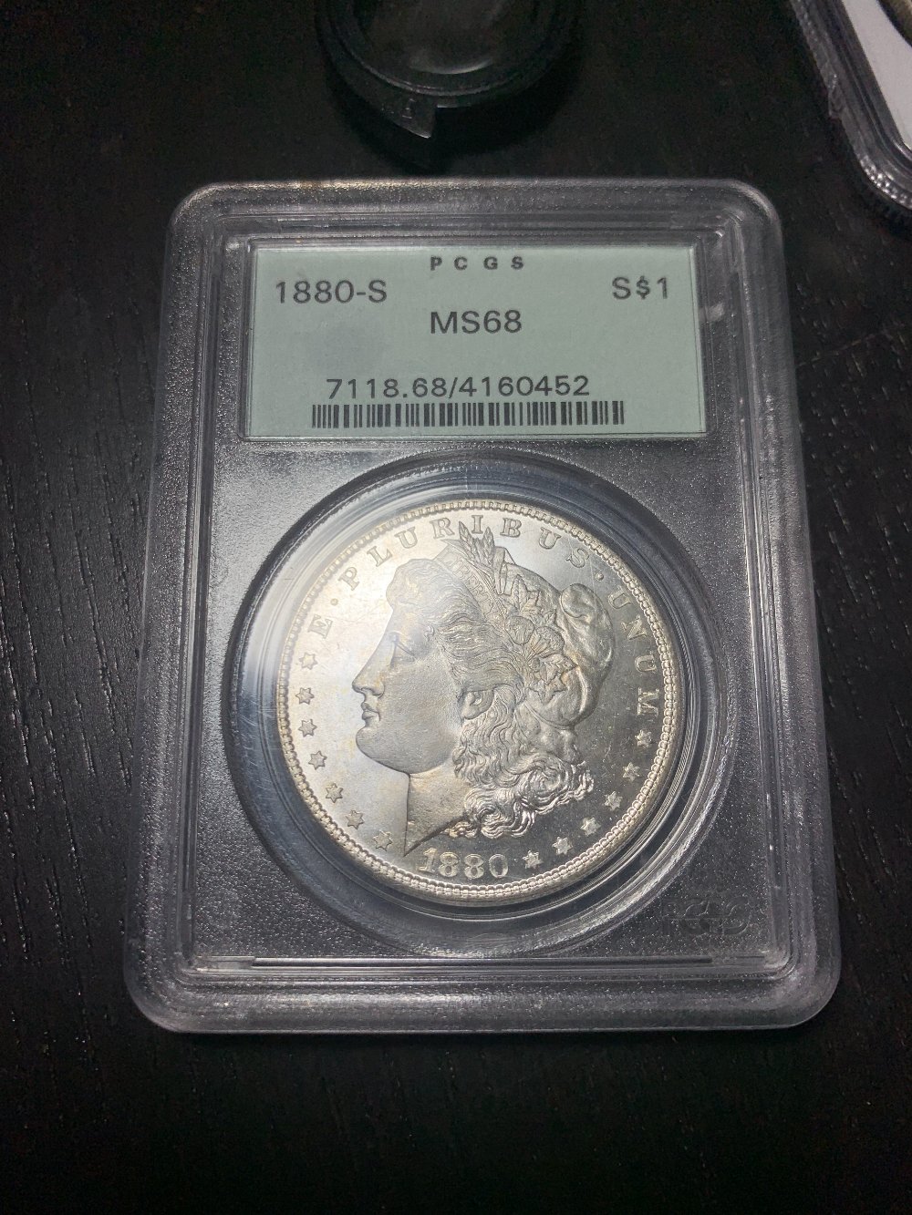 Showing-Off-A-New-Pickup.1880-S-Morgan-PCGS-MS-68-OGH