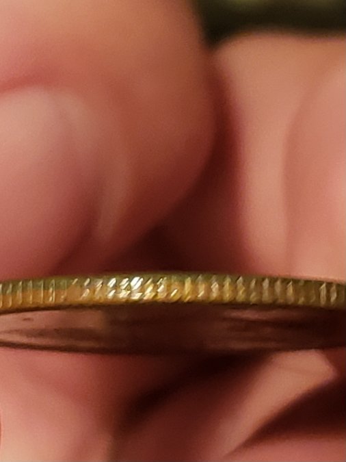 Help,-2005-D-Kansas-Quarter-Odd-Color?