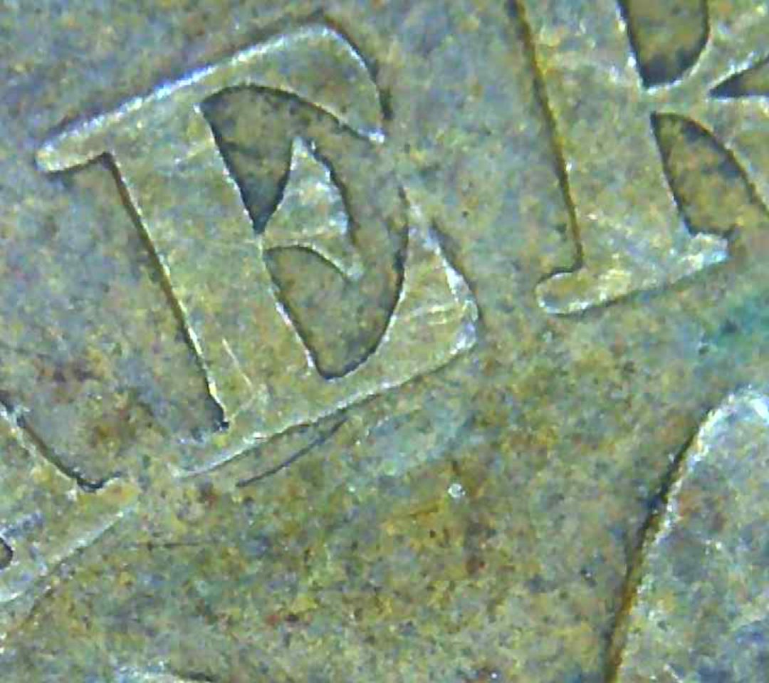 1890-Penny-With-Some-Sort-Over-Overlay-Can-Make-Out-A-7-And-A-Few-Others