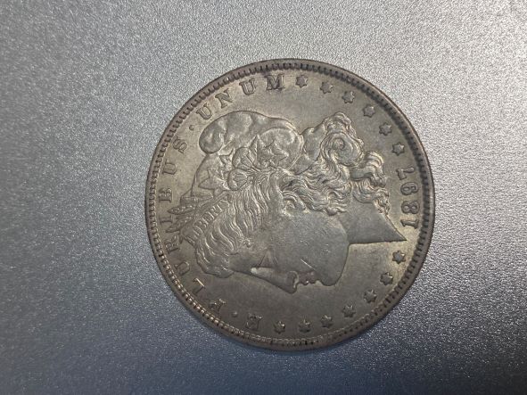 1897-O-One-Dollar-Silver-Coin-To-Grading