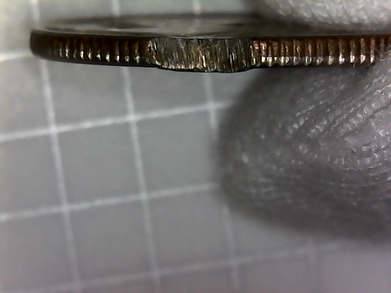 1965-Quarter-Clipped-Or-Cut-Planchet-Two-Places