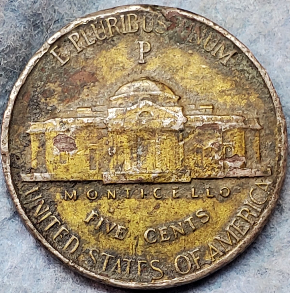What-Is-This-Yellow-Tint-On-This-1944-P-War-Nickel?