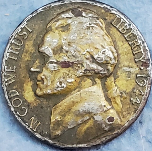 What-Is-This-Yellow-Tint-On-This-1944-P-War-Nickel?
