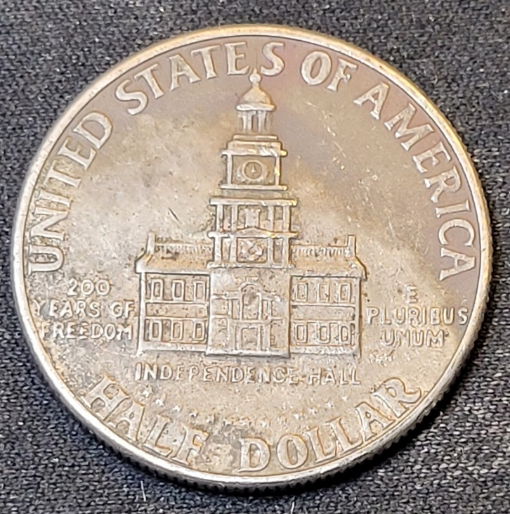 1976-D-Kennedy-Half-Dollar-With-A-Big-O-Bubble-On-The-Obverse