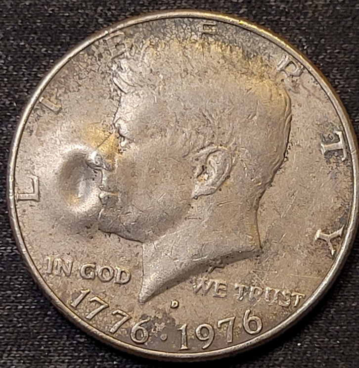 1976-D-Kennedy-Half-Dollar-With-A-Big-O-Bubble-On-The-Obverse