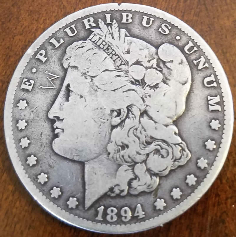 Strange-Symbol-On-This-1894-S-Morgan-And-Washington-Quarter