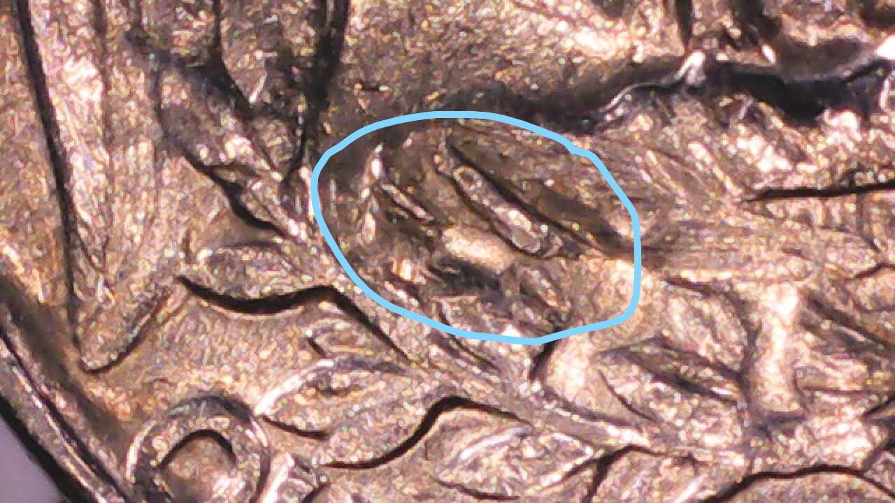 1969-D-Quarter-Damage-Or-Strike-Through?