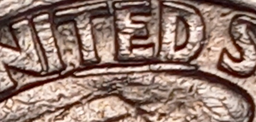 1986-Washington-Quarter-With-A-Die-Chip-Under-United