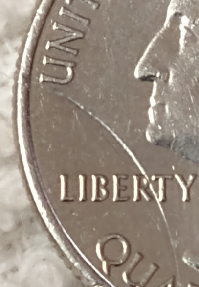 2018-Quarter-Struck-Through-Large-Rim-Burr