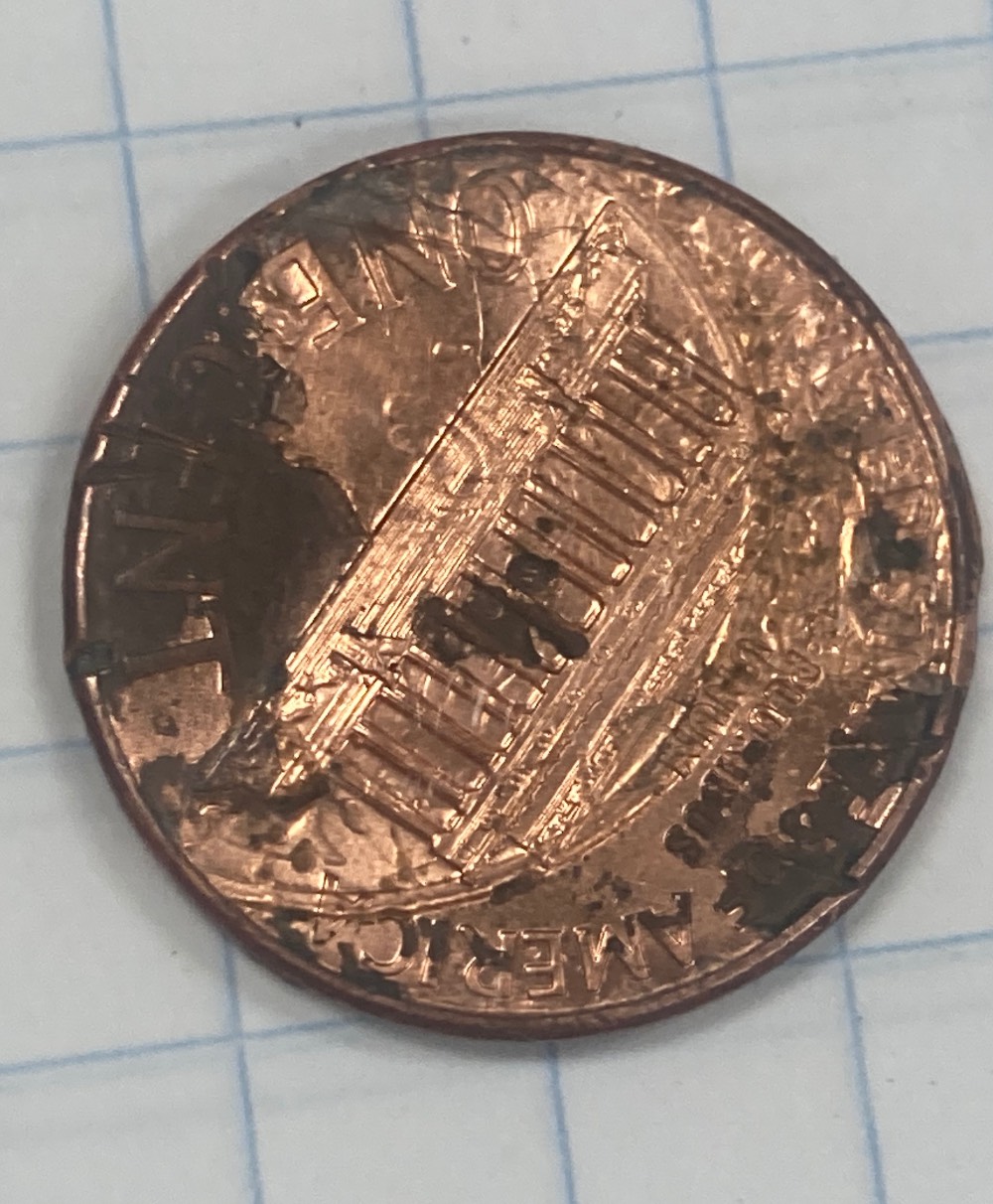 Crazy-Penny,-Imprint-Of-A-Dime.-You-Can-See-The-Ear.