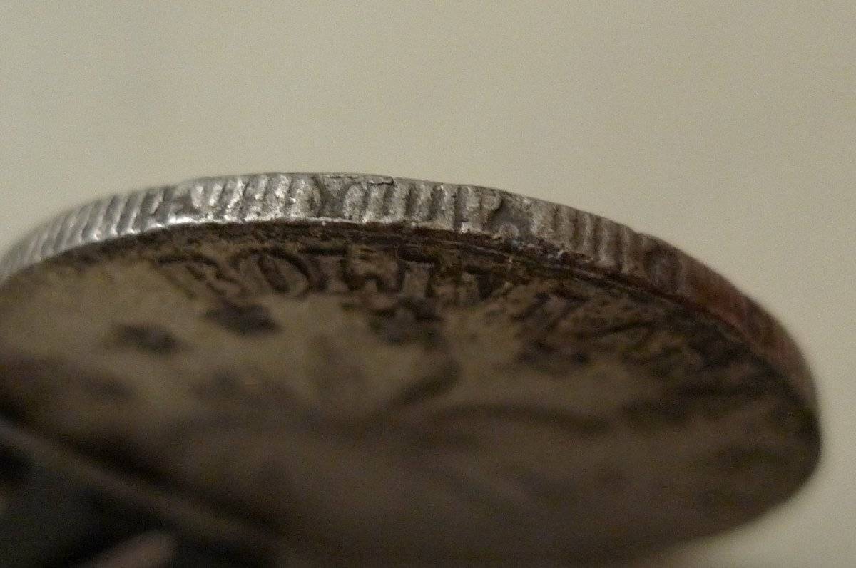 4-Soles-1858-Struck-On-A-Previous-Coin?