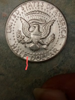 Found-A-1971-D-Half-Dollar-With-Marks-In-Between-Lettering-And-The-Date?
