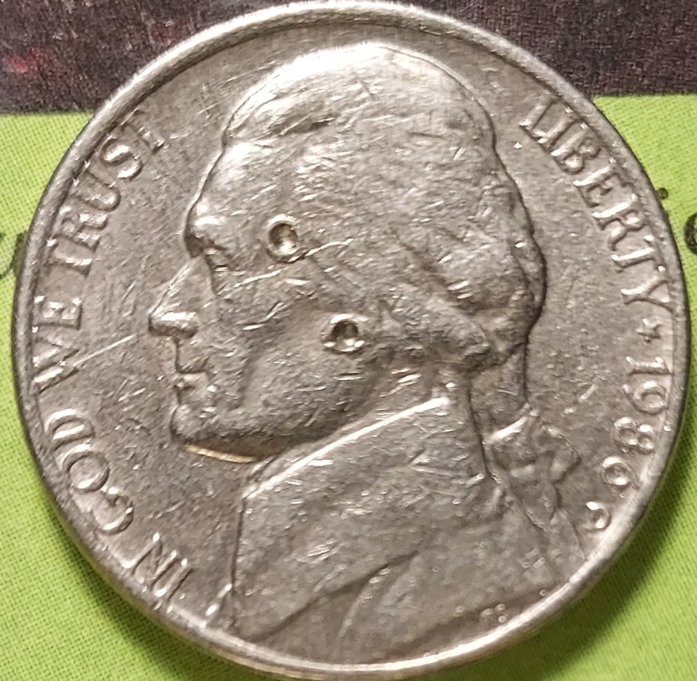 1986-D-Nickel-With-3-Perfect-Circles.-I'm aware-Its-Probably-Just-Damage