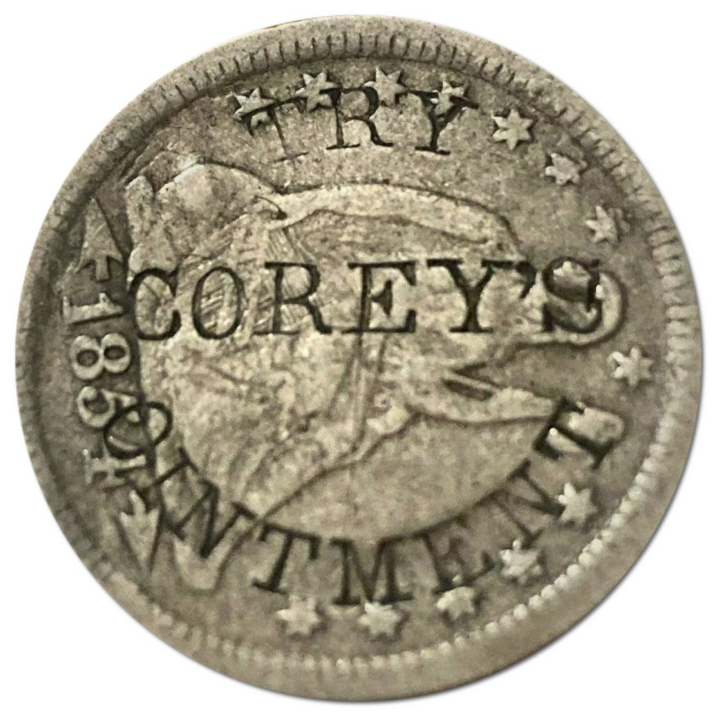 An-1857-Quarter-With-A-Patent-Medicine-Counterstamp