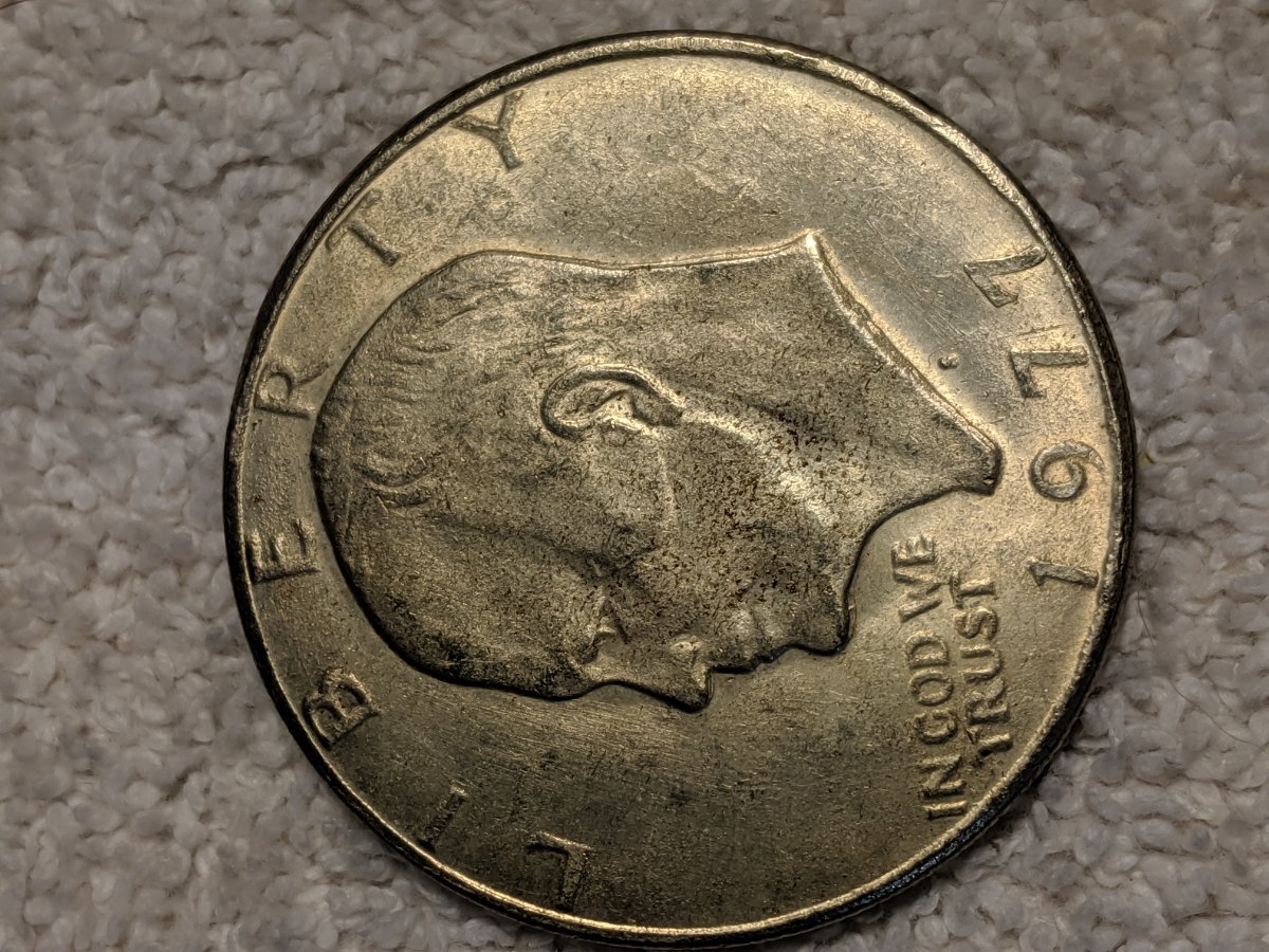1977-S-Dollar-Silver-One-Legged-Eagle,-Struck-Through-Grease?