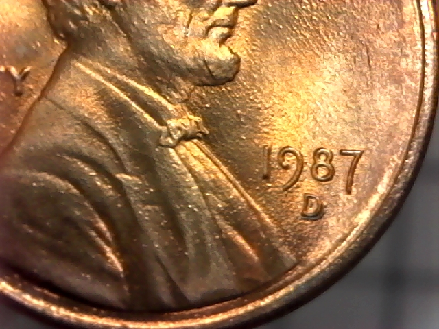 Why-Do-The-Letters-On-This-1987-D-Penny-Look-Like-They-Are-On-An-Inner-Rim?
