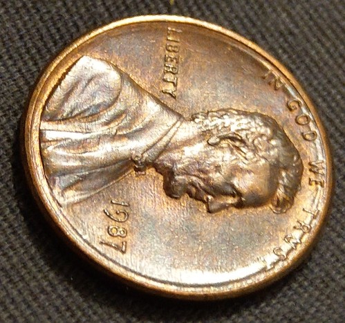 1987-Penny-W/-Strange-Rim-Through-