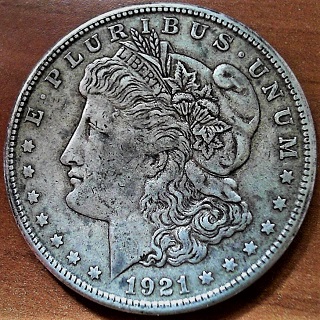 1921-S/?-Morgan;-Can't-Make-Out-What's-Under-The-MM