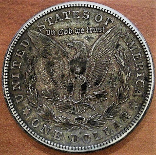 1921-S/?-Morgan;-Can't-Make-Out-What's-Under-The-MM