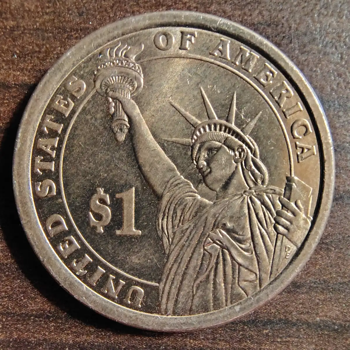 Inscription-On-Edge-Of-Presidential-$1-Coin-Is-Upside-Down