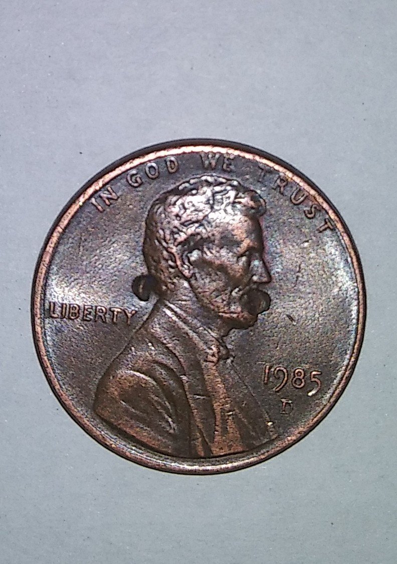 Need-Help-I-Have-1985-Penny-With-Weird-Punch-Marks.