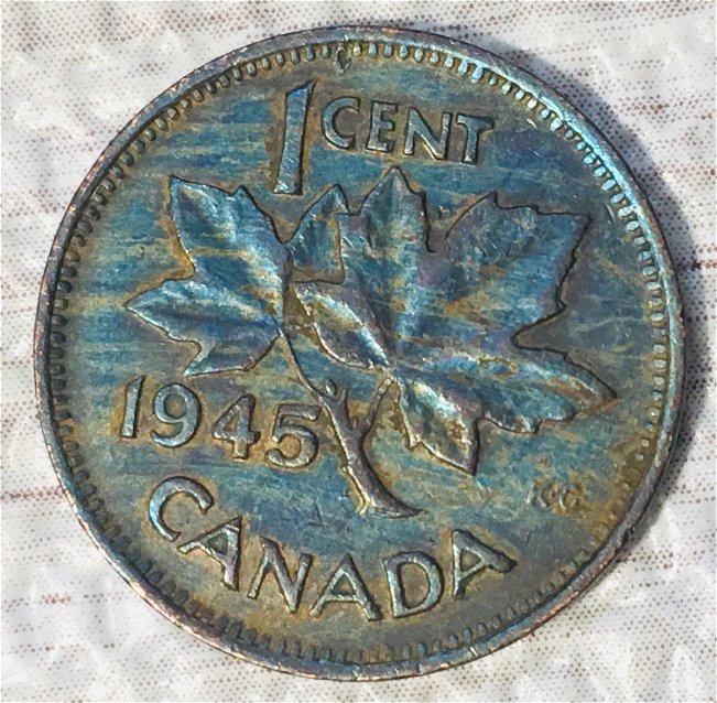 What-Could-Cause-Extreme-Shades-Of-Aqua-Blue-And-Violet-On-George-VI--Cent?