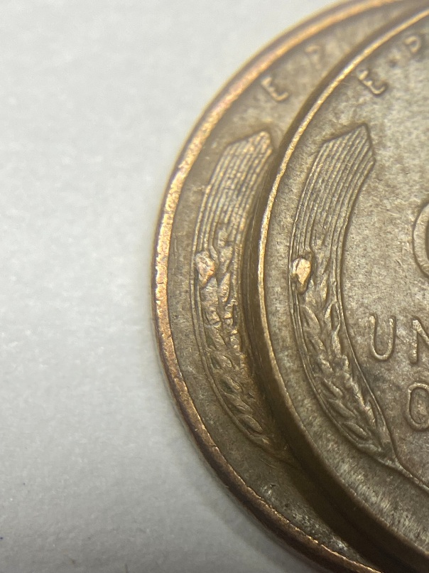 1956-&-1957-Pennies-With-Identical-Die-Chips-On-Reverse.