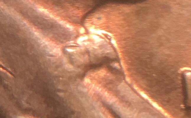 1958-Penny-With-Strange-Marks-On-Bowtie