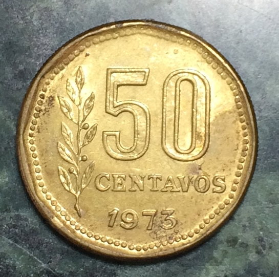 MD-In-Letters-And-Circular-Dots--Near-The-Edge-Of-This-Argentinian-Coin-?