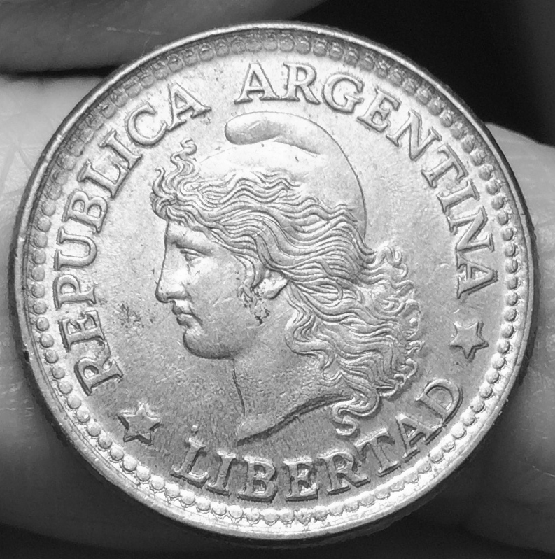 MD-In-Letters-And-Circular-Dots--Near-The-Edge-Of-This-Argentinian-Coin-?
