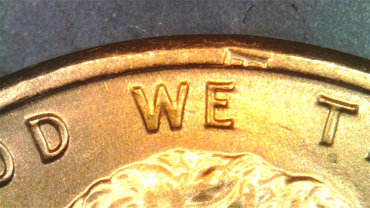 1983-LMC-Extra-Partial-E-On-Rim-Of-We-On-Obverse