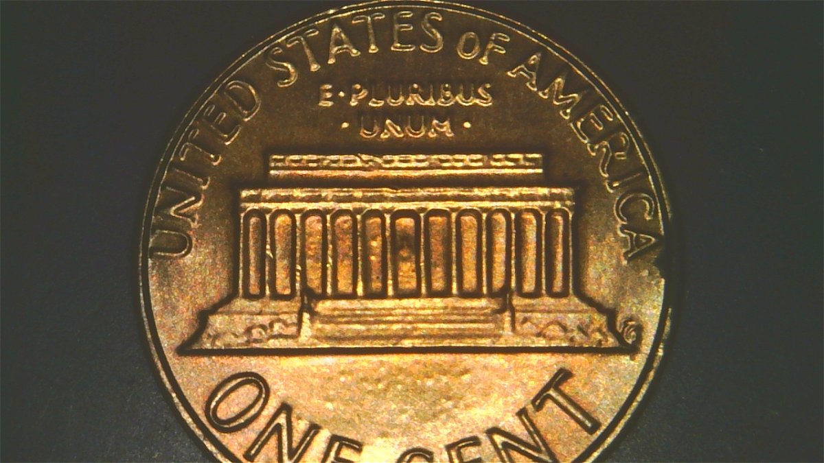1983-LMC-Extra-Partial-E-On-Rim-Of-We-On-Obverse