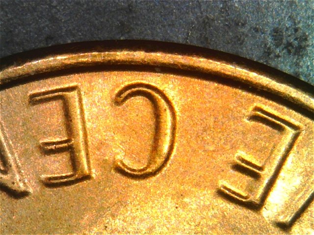 1983-LMC-Extra-Partial-E-On-Rim-Of-We-On-Obverse