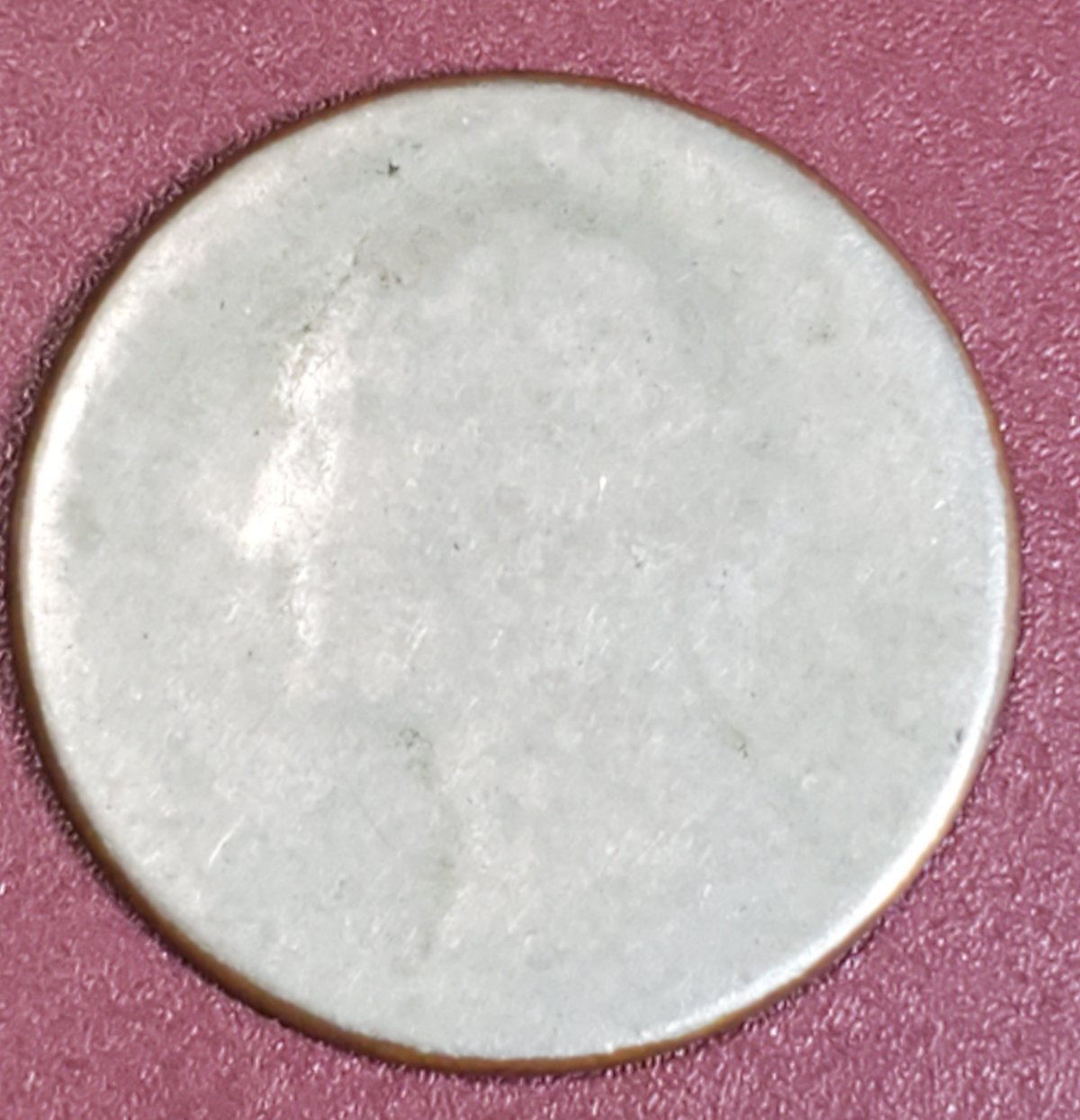 Not-Sure.-Quarter-Silouette-But-Very-Very-Thin,-Weight-4.04g