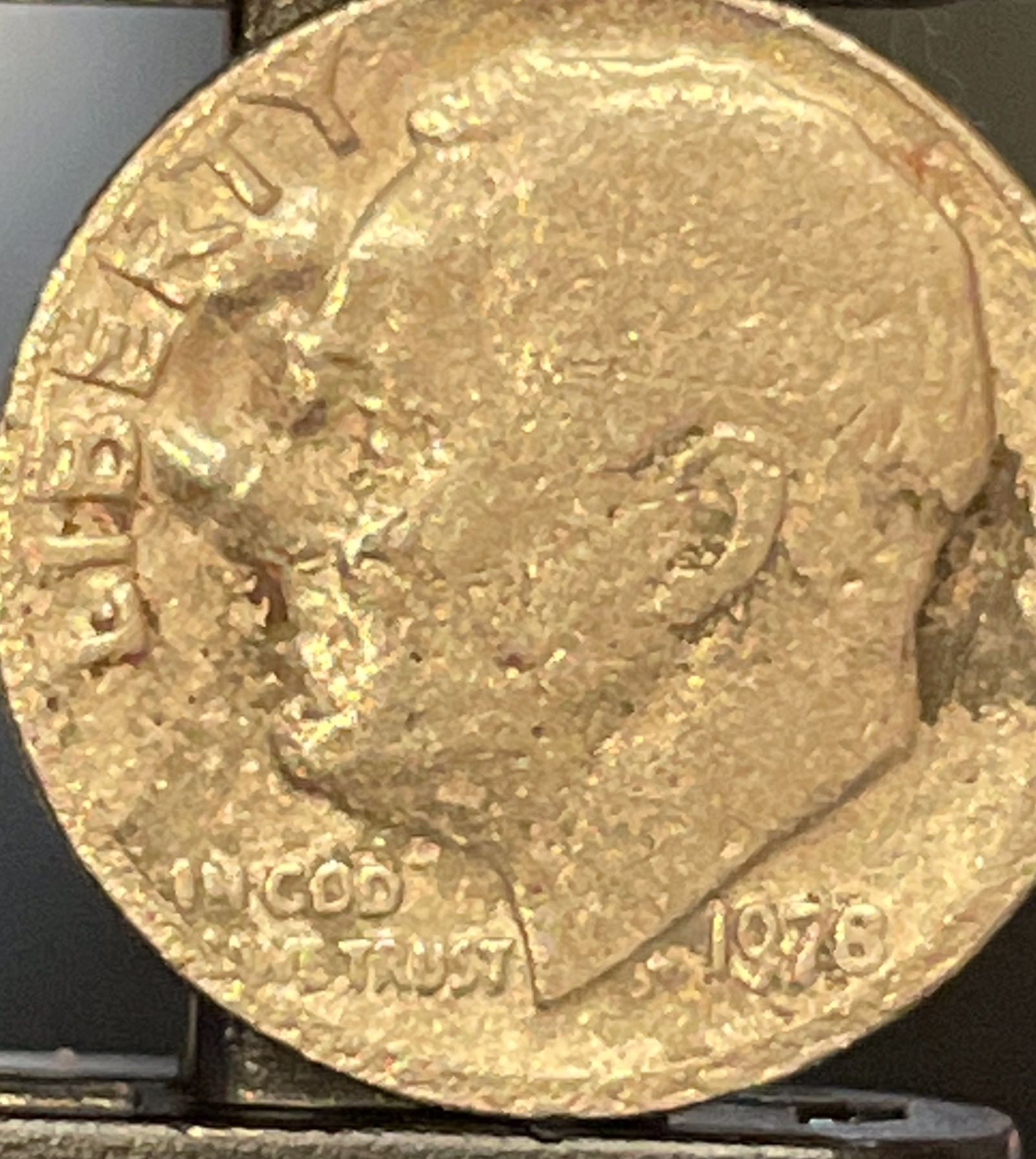 Weird-1978-Nmm-Dime-I-Found.-Does-Anyone-Know-What-The-Print-Is-On-The-Face-Of-The-Dime?