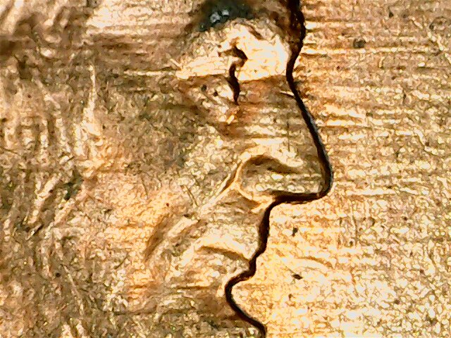 What-Causes-These-Lines-To-Form-On-A-Coin?-And-Why-Do-They-Show-Up-Kinda-Black-To-The-Naked-Eye?