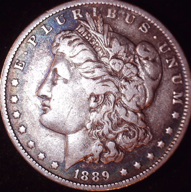 1889---O-Morgan-With-What-Looks-Like-A-Backwards-C-In-The-O-Mint-Stamp-Help
