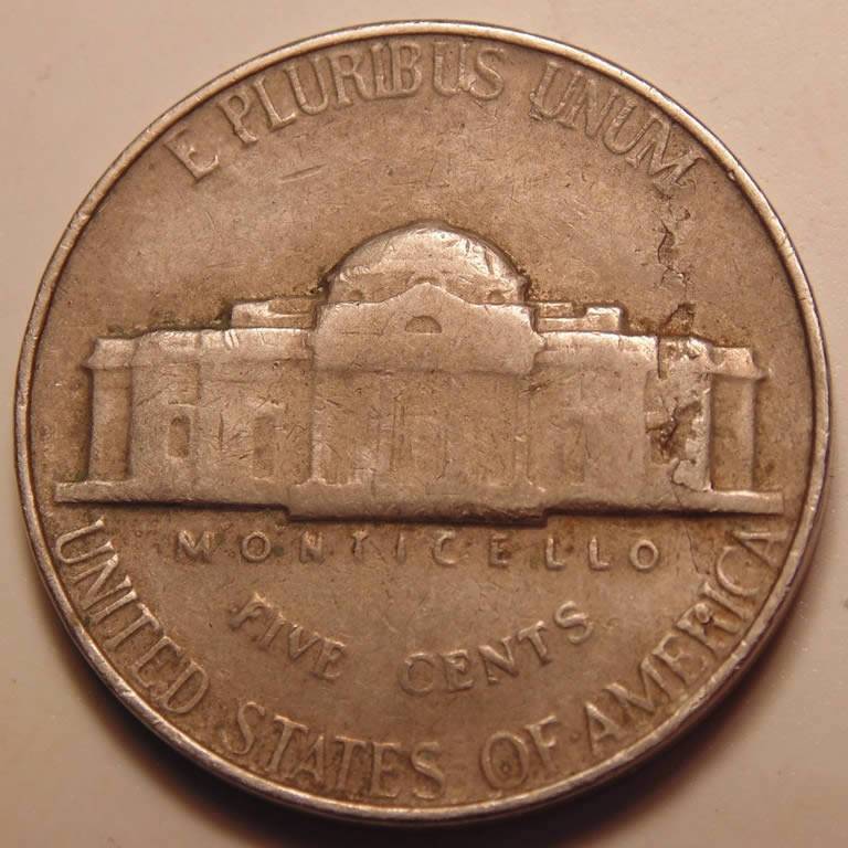 1964-Nickel.-Strike-Through,-Lam-Or-Both?