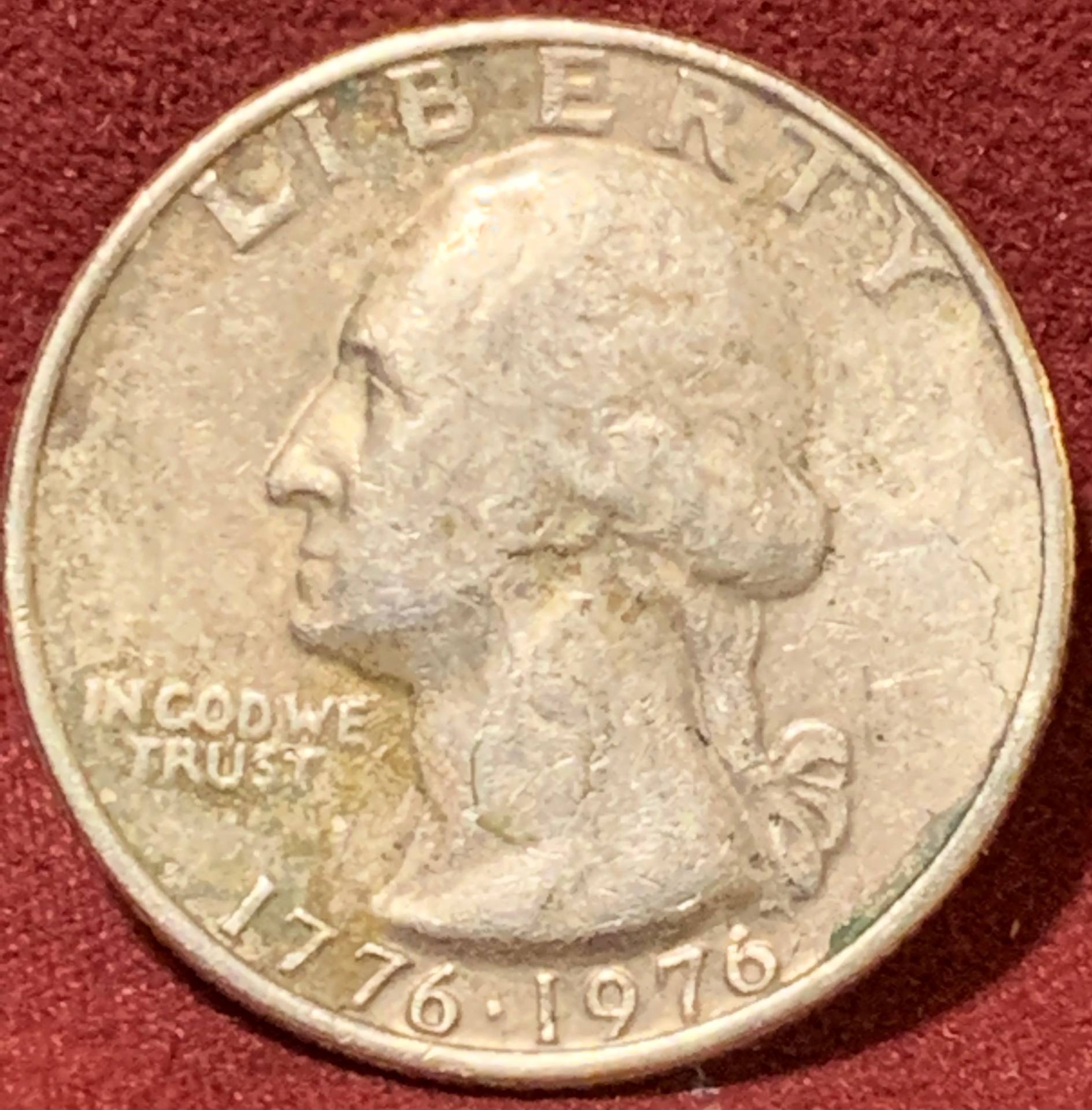1976-Bicentennial-Quarter,-Badly-Battered.-Is-It-Damaged-From-The-Mint-Or-Old-Age?