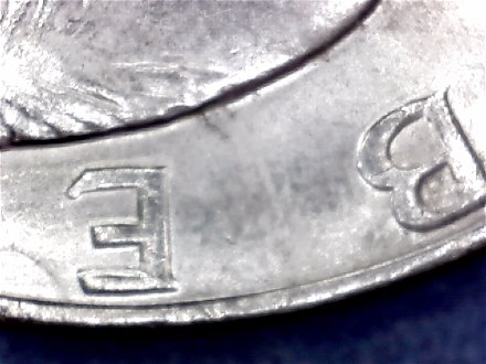 1971-Ike-Dollar-With-Something-Underneath-The-Strike?-Doubling-As-Well-Help