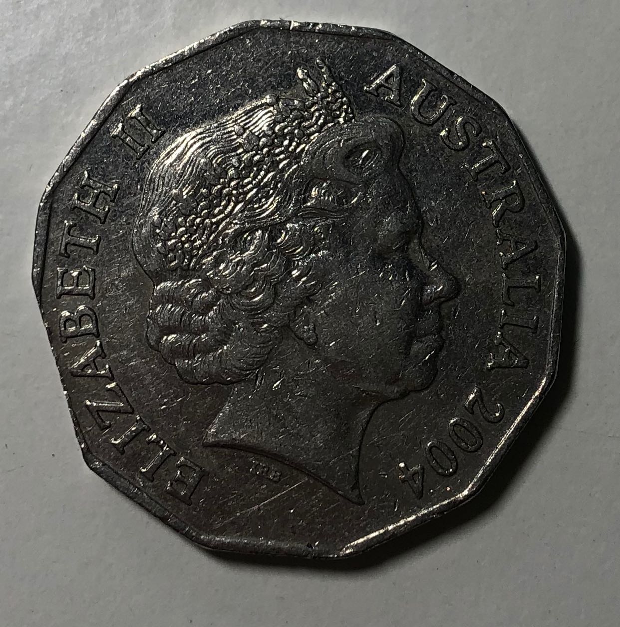 2004-50-Cent:-Planchet-Error-Or-Post-Mint-Damage?